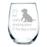 Dog drinking glass